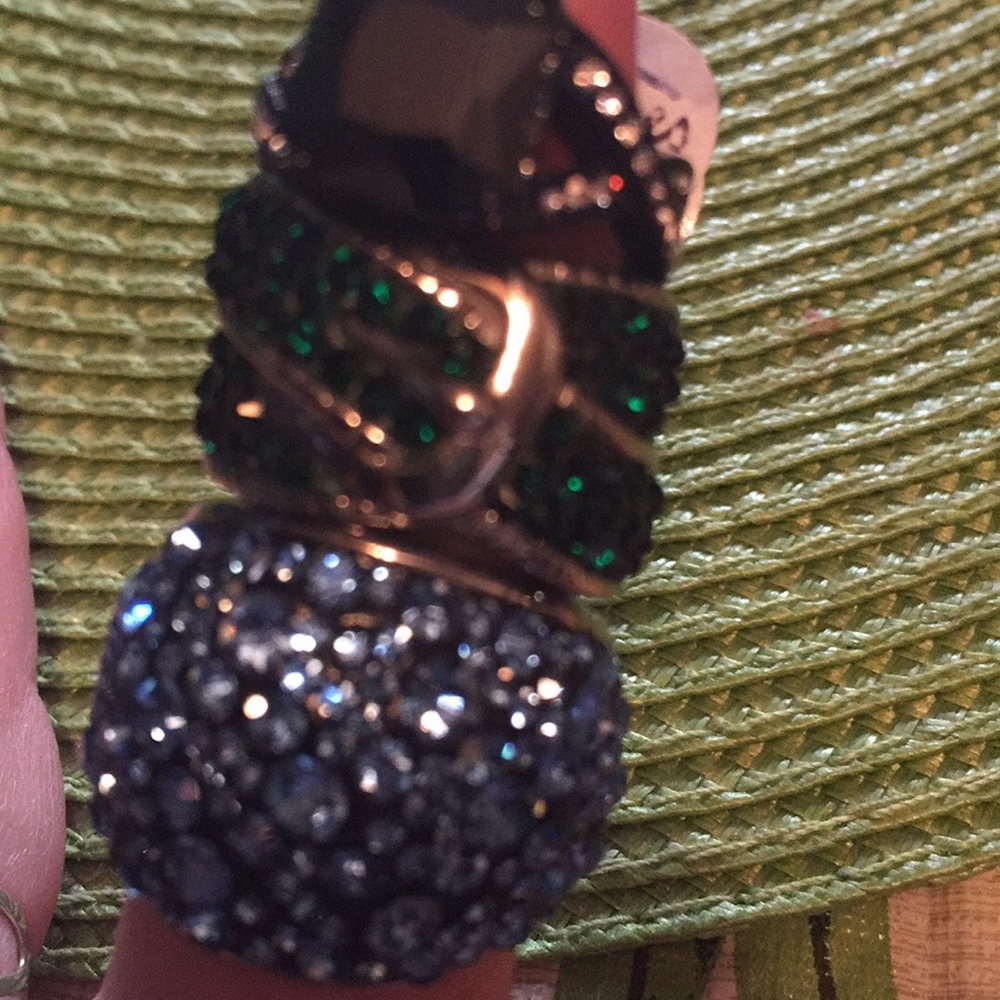 New crystal rings set in ss . Size 7